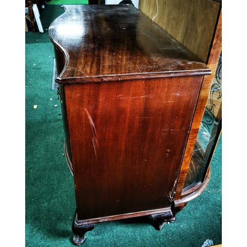 486 - Serpentine solid mahogany cabinet stamped W. Fowkes on top of the doors