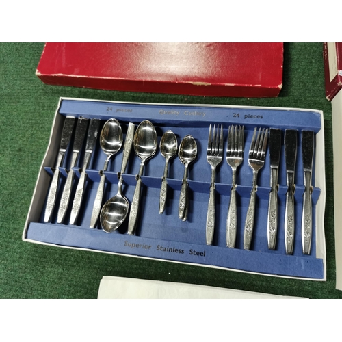 14 - Two cased cutlery sets  one by oneida along with a complete fruit and ice cream 12 person set