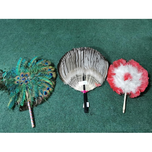 16 - Three vintage feather hand held fans, one has damage