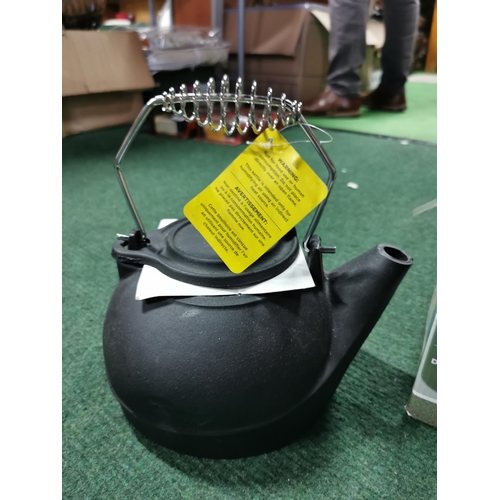 21 - Boxed cast iron kettle, wicker basket, quantity of table mats etc