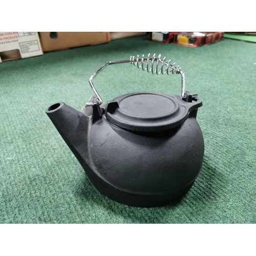 21 - Boxed cast iron kettle, wicker basket, quantity of table mats etc