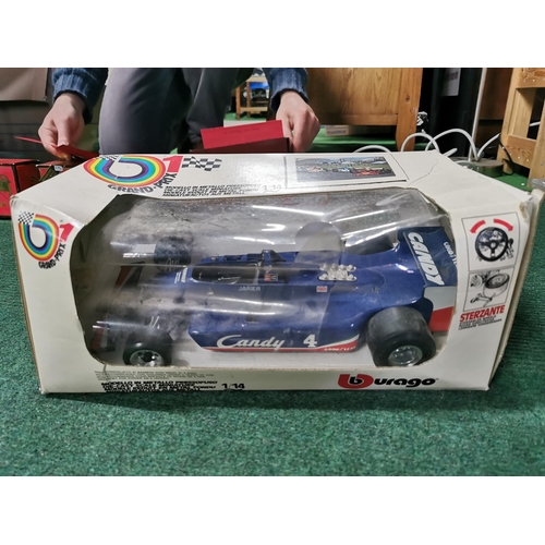 25 - Boxed burago grand prix formula one car along with a large plastic shell tanker lorry