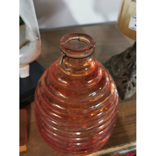 32 - Two antique oil lamps and a orange glass fly catcher