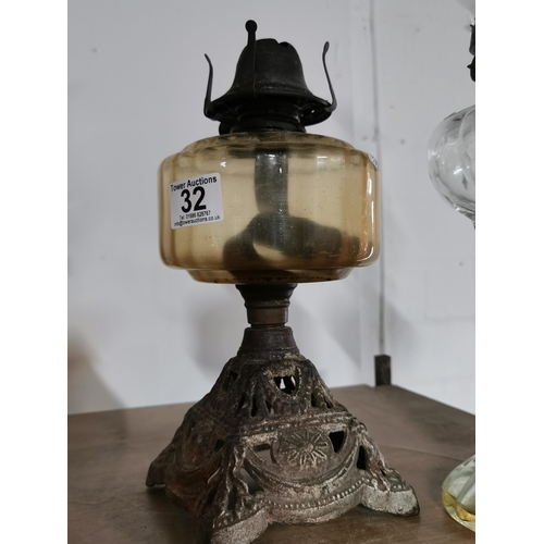 32 - Two antique oil lamps and a orange glass fly catcher