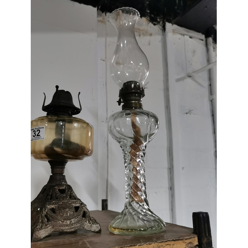 32 - Two antique oil lamps and a orange glass fly catcher