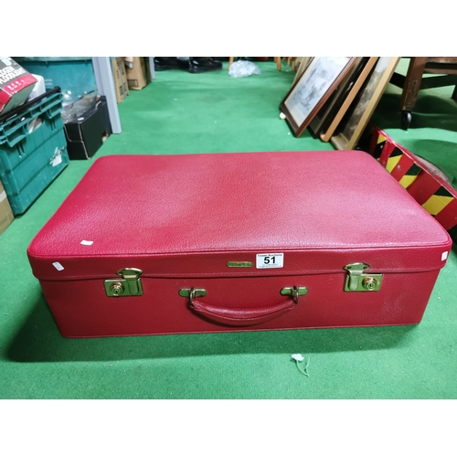 51 - Red suitcase containing a quantity of odds inc a bongo drum, ethnic figure an ornate wood and copper... 