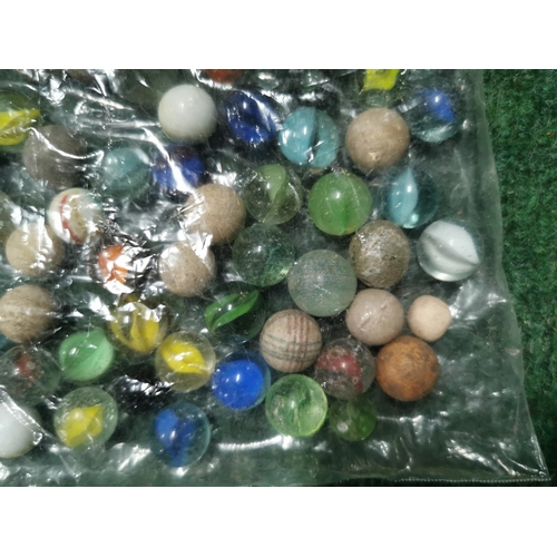 56 - Bag full of various vintage marbles