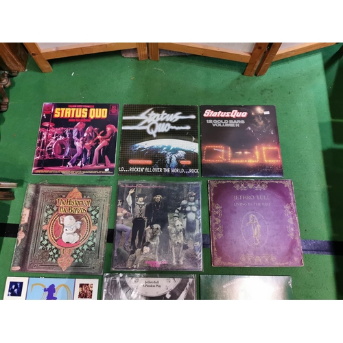 77 - Collection of vinyl records mostly 80's rock inc Slade, Mike Oldfeld, Jethro Tull.