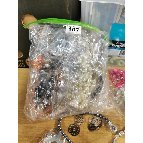 107 - bag containing a very large quantity of various costume jewellery