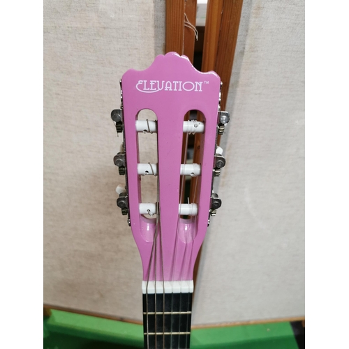 133 - Pink elevation accoustic guitar with stand clean condition