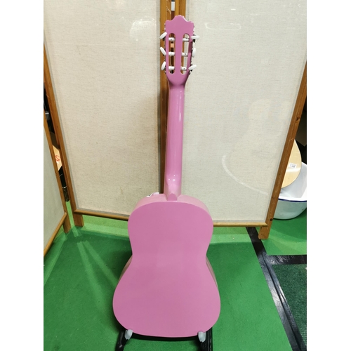 133 - Pink elevation accoustic guitar with stand clean condition