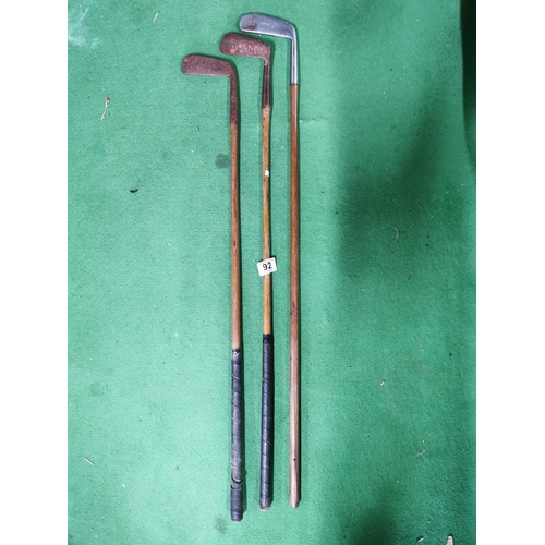 92 - Three early hickory shaft putters