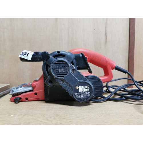 571 - Black and decker belt sander along with a large quantity of unused sanding belts in plastic tool che... 