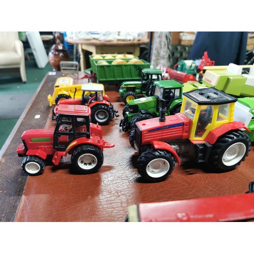 56e - Large collection of mostly diecast farm vehicles inc a good quantity of tractors and combine harvest... 