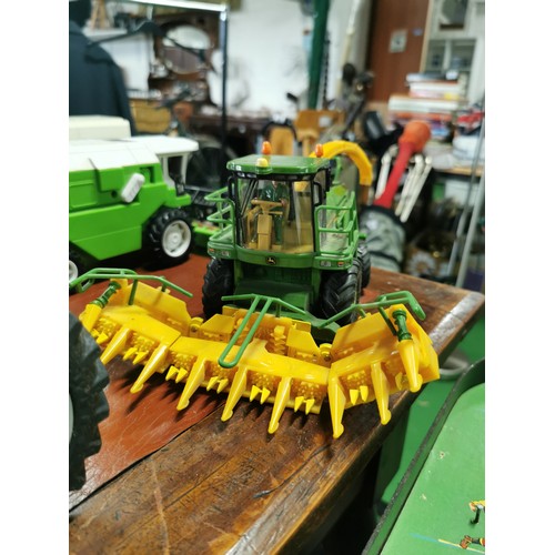 56e - Large collection of mostly diecast farm vehicles inc a good quantity of tractors and combine harvest... 