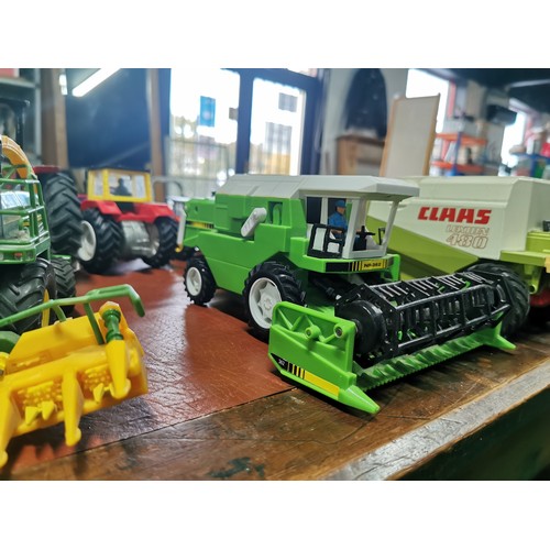 56e - Large collection of mostly diecast farm vehicles inc a good quantity of tractors and combine harvest... 