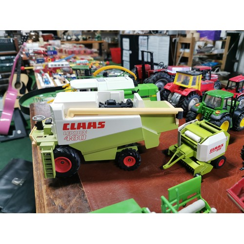 56e - Large collection of mostly diecast farm vehicles inc a good quantity of tractors and combine harvest... 