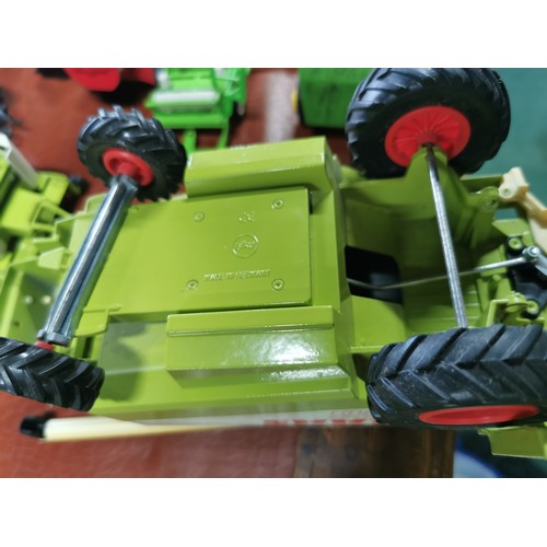 56e - Large collection of mostly diecast farm vehicles inc a good quantity of tractors and combine harvest... 