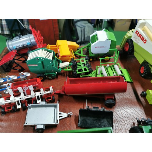 56e - Large collection of mostly diecast farm vehicles inc a good quantity of tractors and combine harvest... 