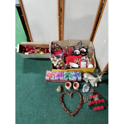 36 - Two boxes full of Christmas decorations including a gold glitter reindeer, baubles, tree decorations... 