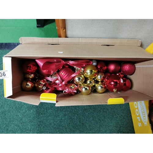 36 - Two boxes full of Christmas decorations including a gold glitter reindeer, baubles, tree decorations... 