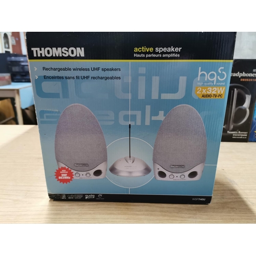 14 - 2x new boxed wireless headphones by Nippon and Ikasu, along with Thomson wireless UHS speakers