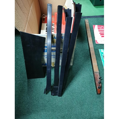 39 - Magnus electric organ in original box with removable legs along with music books and along with anot... 