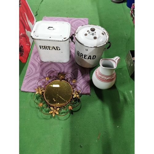 54 - Two vintage enamel bread bins along with vintage metal framed copper tone mirror and a vintage jug w... 