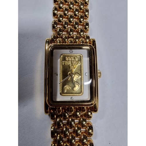 295 - Brand new old stock brooks & Bentley gold plated footprints in the sand ladies watch with a 1g ingot... 