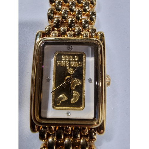 295 - Brand new old stock brooks & Bentley gold plated footprints in the sand ladies watch with a 1g ingot... 