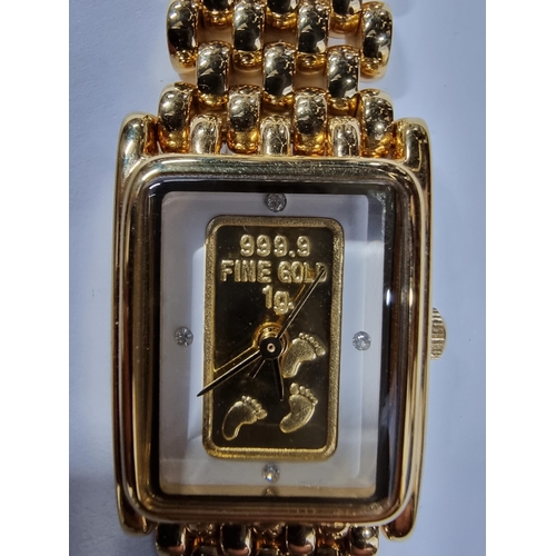 295 - Brand new old stock brooks & Bentley gold plated footprints in the sand ladies watch with a 1g ingot... 