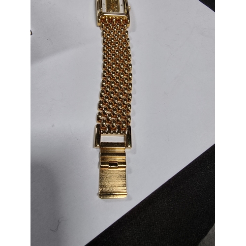 295 - Brand new old stock brooks & Bentley gold plated footprints in the sand ladies watch with a 1g ingot... 