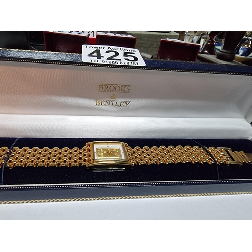 295 - Brand new old stock brooks & Bentley gold plated footprints in the sand ladies watch with a 1g ingot... 