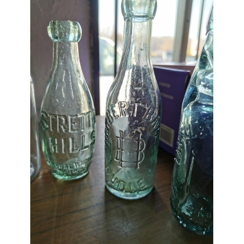 386 - Collection of various good vintage collectable glass bottles with advertising inc Longmynd Waters, H... 