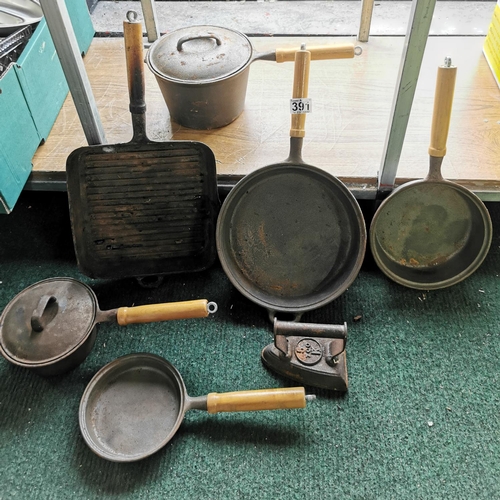 391 - Large quantity of cast iron saucepans, Skillets, antique iron etc, all are matching with wooden hand... 