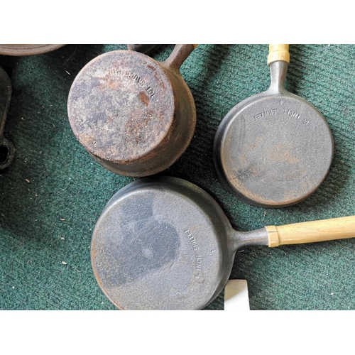 391 - Large quantity of cast iron saucepans, Skillets, antique iron etc, all are matching with wooden hand... 