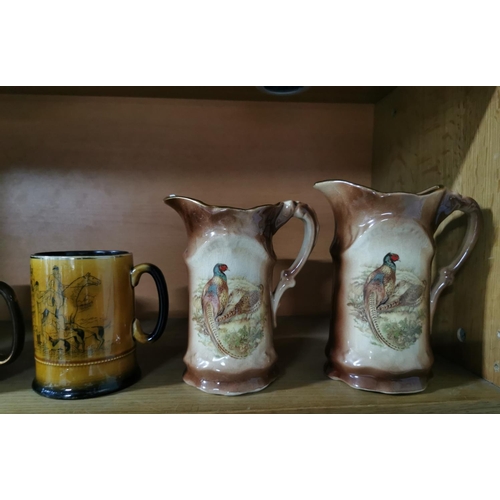 146 - Collection of jugs and tankards mostly realting two hunting inc two Pheasent jugs by Staffordshire I... 