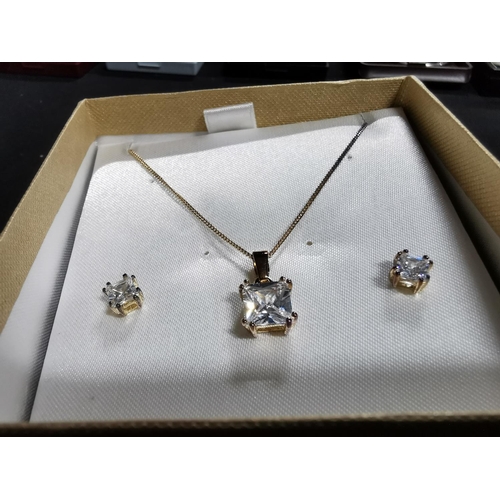 260 - Matching gold plated on 925 sterling silver pendant chain and earrings inset with large CZ stones ch... 