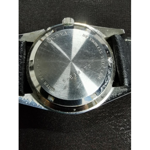 264 - Vinatge gents swiss quartz watch by Bulova with day date in good clean condition with a good calf gr... 