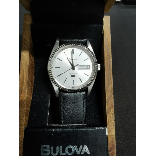 264 - Vinatge gents swiss quartz watch by Bulova with day date in good clean condition with a good calf gr... 