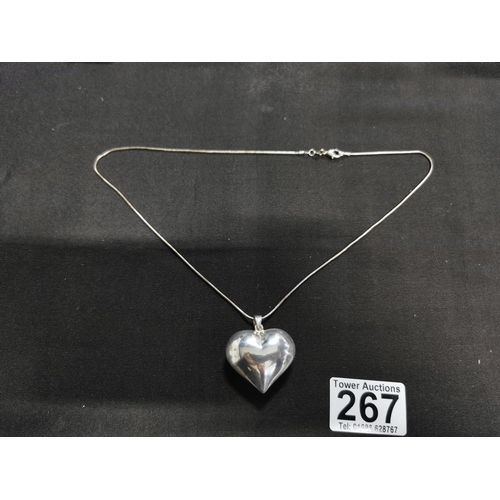 267 - Large 925 silver heart formed pendant on a long 925 silver chain height of pendant 4cm width 4cm tot... 