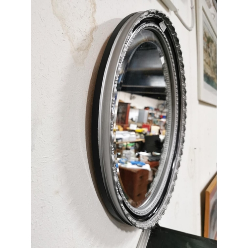 109 - Oval bevelled mirror with silver colour frame 45.5cm x 35.5cm