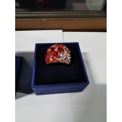 45 - Boxed Swarovski crystal chic dome ring - gold, red radiant to pale pink, size Q. In good condition w... 