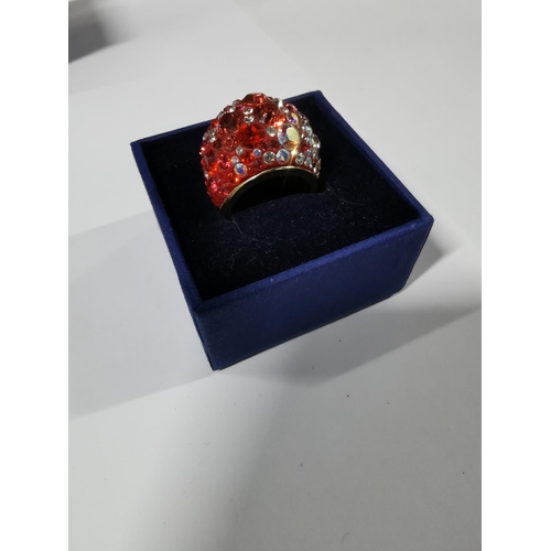 45 - Boxed Swarovski crystal chic dome ring - gold, red radiant to pale pink, size Q. In good condition w... 