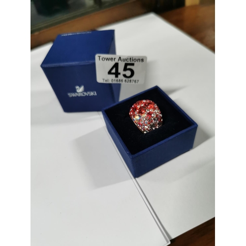 45 - Boxed Swarovski crystal chic dome ring - gold, red radiant to pale pink, size Q. In good condition w... 