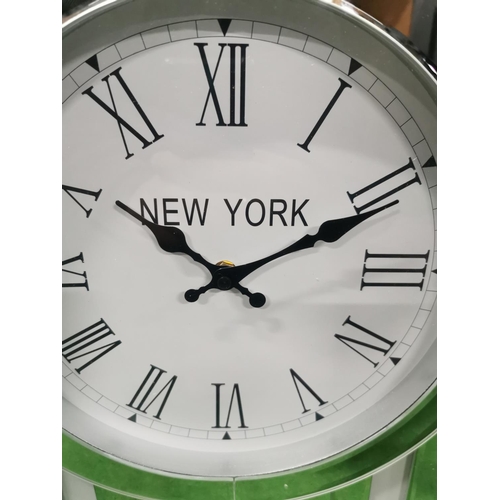 92 - New York Inspired Mirrored & White Glass Tabletop Quartz Clock, has a small chip as shown on photos.... 