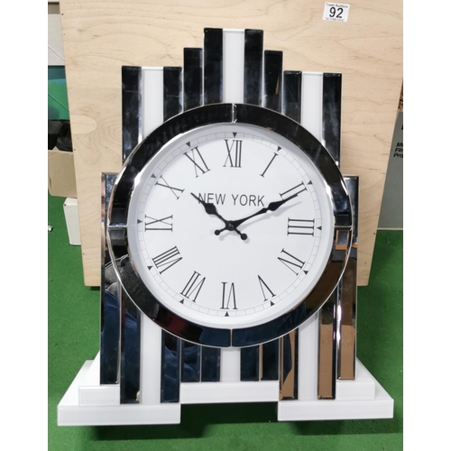 92 - New York Inspired Mirrored & White Glass Tabletop Quartz Clock, has a small chip as shown on photos.... 