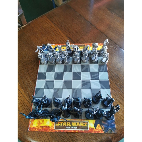 119 - X2 board games inc Star Wars chess set is complete  and Subbuteo table football game