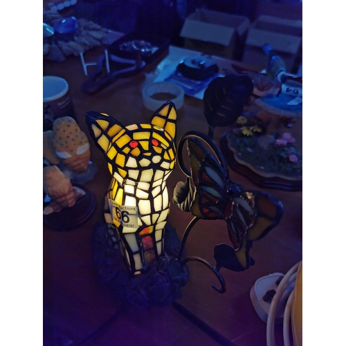 66 - Pretty tiffany style cat formed table lamp looking up at a butterfly, butterfly has an old fix in wo... 