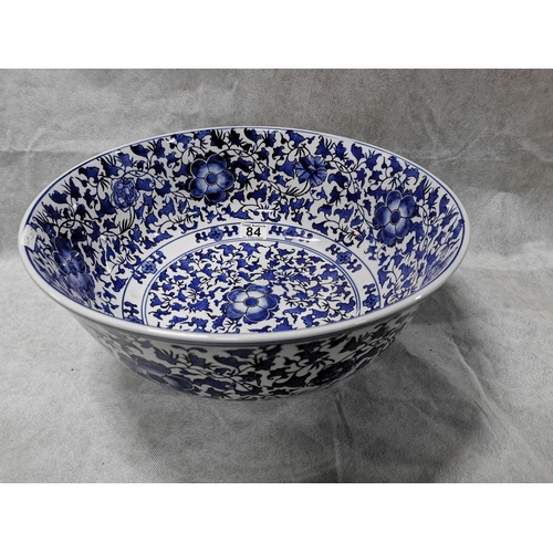 84 - Very large decorative blue and white ceramic bowl  18.5cm high, 41 cm diameter
2cm old repair
No pos... 